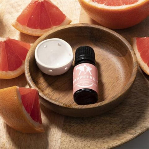 Saunum Aroma Oil Grapefruit in ceramic bowl